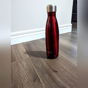3./&$30.  Ekco Metal Water Bottle. Red 10 inches tall. 2.5 inches wide.